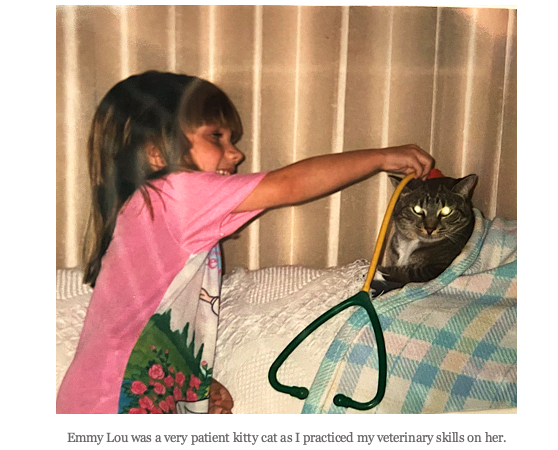 A picture of the author as a child with her cat: Emmy Lou was a very patient kitty cat as I practiced my veterinary skills on her.