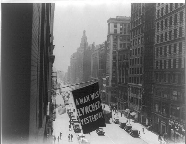 A flag on a NYC building that reads: A man was lynched yesterday.