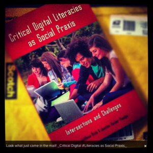 photo of book “Critical Digital Literacies as Social Praxis” sitting on envelope used to ship it